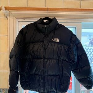 The North Face Black Puffer Jacket Essential for Cold Weather